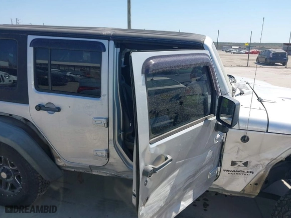 2007 Jeep Wrangler Unlimited X with VIN 1J4GA39197L161975, listed as a IAAI auction lot 41742409 with 270,227 mi miles. Bid and sale history available at carsss.com. Image 13.