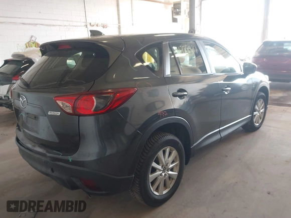2014 Mazda CX-5 Sport with VIN JM3KE4BE5E0375360, listed as a IAAI auction lot 41788977 with 135,487 mi miles. Bid and sale history available at carsss.com. Image 4.