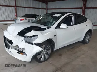 2023 Tesla Model Y Long Range z VIN 7SAYGDEE2PF834036, wystawiony jako IAAI lot #41933120 z przebiegiem 27 872 mil mil oraz . Historia ofert i sprzedaży dostępna na DreamBid. Obrazek 18.