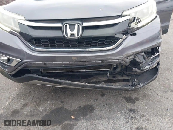 2015 Honda CR-V EX with VIN 3CZRM3H51FG704087, listed as a IAAI auction lot 42074521 with 74,610 mi miles and . Bid and sale history available at carsss.com. Image 6.