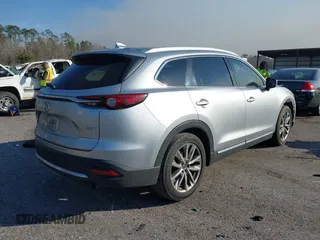 2017 Mazda CX-9 Grand Touring with VIN JM3TCADY5H0138176, listed as a IAAI auction lot 41458610 with 114,664 mi miles and . Bid and sale history available at DreamBid. Image 4.