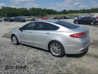 2017 Ford Fusion SE z VIN 3FA6P0H74HR164747, wystawiony jako Copart lot #56139855 z przebiegiem 105 769 mil mil oraz Szkoda całkowita • Salvage title. Historia ofert i sprzedaży dostępna na DreamBid. Obrazek 2.