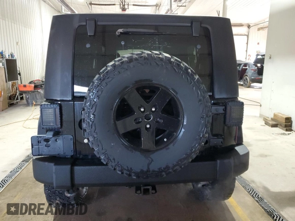 2009 Jeep Wrangler Unlimited Rubicon with VIN 1J8GA69179L756441, listed as a Copart auction lot 52111435 with 157,818 mi miles and Salvage title. Bid and sale history available at DreamBid. Image 6.