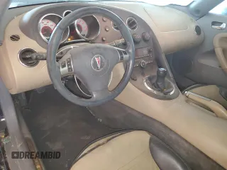2006 Pontiac Solstice z VIN 1G2MB33B96Y107184, wystawiony jako Copart lot #74216894 z przebiegiem 190 765 mil mil oraz Czysty tytuł • Clean title. Historia ofert i sprzedaży dostępna na DreamBid. Obrazek 8.