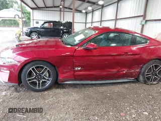 2018 Ford Mustang EcoBoost with VIN 1FA6P8TH7J5101309, listed as a IAAI auction lot 42211115 with 70,661 mi miles and . Bid and sale history available at DreamBid. Image 6.