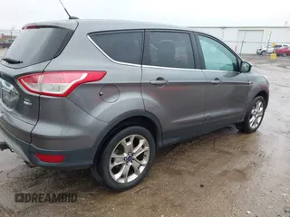 2013 Ford Escape SEL with VIN 1FMCU9H96DUD50249, listed as a IAAI auction lot 41210088 with 208,582 mi miles and . Bid and sale history available at DreamBid. Image 4.