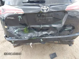 2018 Toyota RAV4 XLE with VIN 2T3RFREV1JW697044, listed as a IAAI auction lot 41891412 with 140,145 mi miles. Bid and sale history available at carsss.com. Image 6.