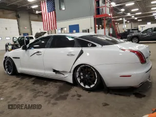 2014 Jaguar XJ Portfolio with VIN SAJWJ2GD2E8V69597, listed as a Copart auction lot 57798145 with 100,857 mi miles and Salvage title. Bid and sale history available at DreamBid. Image 2.