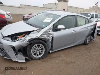 2022 Toyota Prius L Eco with VIN JTDKAMFU9N3185999, listed as a IAAI auction lot 41428106 with 50,798 mi miles. Bid and sale history available at carsss.com. Image 6.