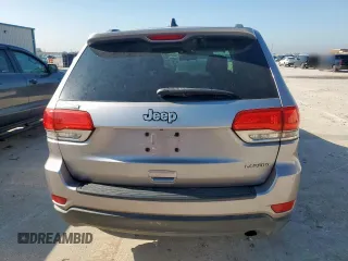 2014 Jeep Grand Cherokee Laredo with VIN 1C4RJEAG4EC182773, listed as a Copart auction lot 54085255 with 138,775 mi miles and Salvage Title. Bid and sale history available at DreamBid. Image 6.