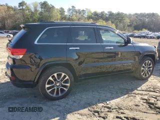 2017 Jeep Grand Cherokee Overland with VIN 1C4RJFCT3HC755960, listed as a Copart auction lot 52268895 with 99,998 mi miles and Salvage title. Bid and sale history available at DreamBid. Image 3.