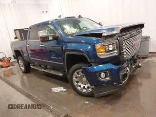 2015 GMC Sierra 2500HD available WiFi Denali with VIN 1GT120E86FF655301, listed as a IAAI auction lot 41965001 with 74,136 mi miles. Bid and sale history available at carsss.com. Image 1.