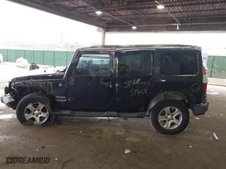 2015 Jeep Wrangler Unlimited Willys Wheeler with VIN 1C4BJWDG9FL652607, listed as a IAAI auction lot 41836193 with 166,152 mi miles. Bid and sale history available at carsss.com. Image 14.