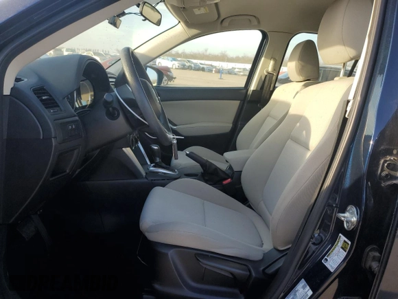 2015 Mazda CX-5 Sport z VIN JM3KE2BE6F0491107, wystawiony jako Copart lot #42462395 z przebiegiem 82 528 mil mil oraz Szkoda całkowita • Salvage title. Historia ofert i sprzedaży dostępna na DreamBid. Obrazek 7.
