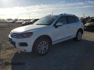 2013 Volkswagen Touareg Sport с VIN WVGEP9BP1DD003208, выставлен на аукционе Copart как лот 70847864 с пробегом 216 562 миль миль и Списание • Salvage title. История ставок и продаж доступна на DreamBid. Изображение 1.