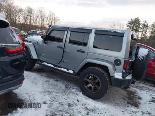 2015 Jeep Wrangler Unlimited Rubicon Hard Rock with VIN 1C4HJWFG1FL659803, listed as a IAAI auction lot 41172485 with 126,881 mi miles and . Bid and sale history available at DreamBid. Image 3.