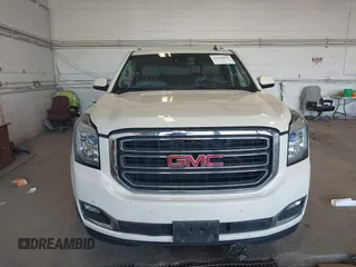 2015 GMC Yukon SLT z VIN 1GKS2BKC8FR109563, wystawiony jako IAAI lot #42194070 z przebiegiem 203 619 mil mil oraz . Historia ofert i sprzedaży dostępna na DreamBid. Obrazek 12.