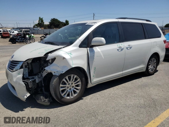 2015 Toyota Sienna XLE with VIN 5TDYK3DC1FS690219, listed as a Copart auction lot 60926525 with 97,879 mi miles and Salvage title. Bid and sale history available at DreamBid. Image 1.