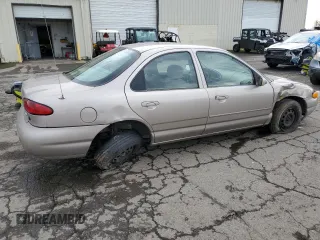 1996 Ford Contour с VIN 3FALP6535TM129390, выставлен на аукционе Copart как лот 73338064 с пробегом 87 588 миль миль и Списание • Salvage title. История ставок и продаж доступна на DreamBid. Изображение 3.