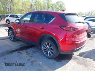 2021 Mazda CX-5 Grand Touring with VIN JM3KFBDM8M1390188, listed as a IAAI auction lot 42000444 with 84,908 mi miles. Bid and sale history available at carsss.com. Image 3.
