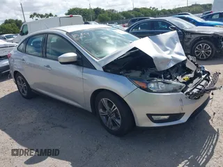 2018 Ford Focus SE z VIN 1FADP3FE3JL220529, wystawiony jako IAAI lot #41564216 z przebiegiem 16 883 mil mil oraz . Historia ofert i sprzedaży dostępna na DreamBid. Obrazek 1.