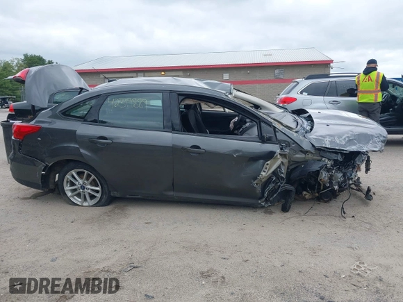 2016 Ford Focus SE z VIN 1FADP3F22GL327604, wystawiony jako IAAI lot #42319889 z przebiegiem 97 736 mil mil oraz . Historia ofert i sprzedaży dostępna na DreamBid. Obrazek 13.