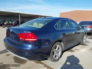2012 Volkswagen Passat SE w/Sunroof with VIN 1VWBH7A35CC077207, listed as a IAAI auction lot 41351317 with 136,904 mi miles. Bid and sale history available at carsss.com. Image 4.
