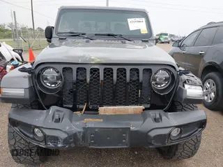 2022 Jeep Gladiator Texas Trail z VIN 1C6HJTAG2NL176011, wystawiony jako IAAI lot #42193864 z przebiegiem 27 219 mil mil oraz . Historia ofert i sprzedaży dostępna na DreamBid. Obrazek 13.
