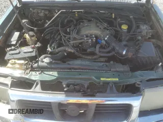 2000 Nissan Frontier XE with VIN 1N6ED27Y4YC382199, listed as a Copart auction lot 47127045 with 207,449 mi miles and Salvage title. Bid and sale history available at DreamBid. Image 12.