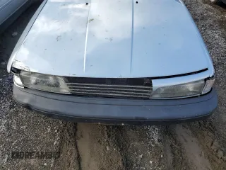 1990 Toyota Camry DLX z VIN 4T1SV21E8LU165609, wystawiony jako Copart lot #79314534 z przebiegiem 153 006 mil mil oraz Szkoda całkowita • Salvage title. Historia ofert i sprzedaży dostępna na DreamBid. Obrazek 11.