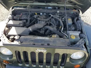 2009 Jeep Wrangler X with VIN 1J4FA24169L707695, listed as a Copart auction lot 49861955 with 89,807 mi miles and Salvage Title. Bid and sale history available at DreamBid. Image 11.