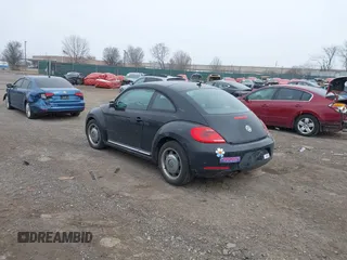 2012 Volkswagen Beetle 2.5L PZEV with VIN 3VWJP7AT0CM628169, listed as a IAAI auction lot 41628754 with 64,770 mi miles. Bid and sale history available at carsss.com. Image 3.