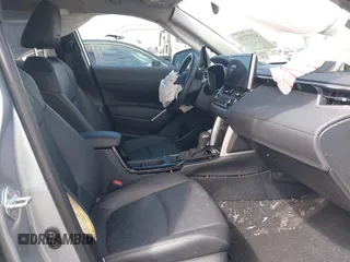2023 Toyota Corolla Cross XLE with VIN 7MUEAABG8PV077117, listed as a IAAI auction lot 42052305 with 21,571 mi miles and . Bid and sale history available at DreamBid. Image 5.