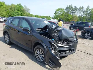 2016 Mazda CX-5 Sport z VIN JM3KE4BY5G0812013, wystawiony jako IAAI lot #42240309 z przebiegiem Nie podano mil oraz . Historia ofert i sprzedaży dostępna na DreamBid. Obrazek 1.