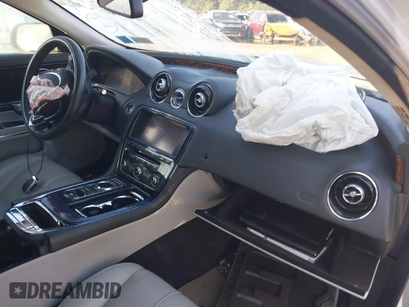 2011 Jaguar XJ with VIN SAJWA1CB1BLV05526, listed as a IAAI auction lot 40162505 with 56,961 mi miles and . Bid and sale history available at DreamBid. Image 5.