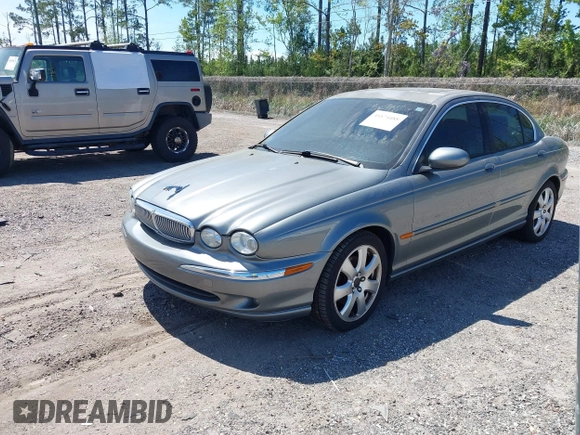2004 Jaguar X-Type with VIN SAJEA51C04WD73023, listed as a IAAI auction lot 41874488 with 199,333 mi miles and . Bid and sale history available at DreamBid. Image 2.
