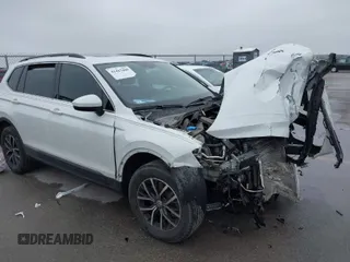 2020 Volkswagen Tiguan SE with VIN 3VV3B7AXXLM018570, listed as a IAAI auction lot 41423460 with 83,248 mi miles and . Bid and sale history available at DreamBid. Image 1.