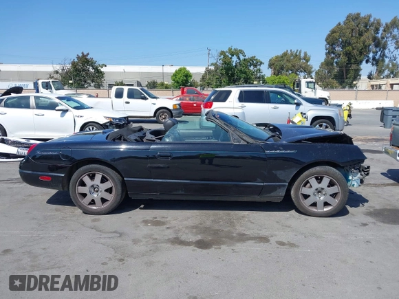 2002 Ford Thunderbird Hardtop Premium z VIN 1FAHP60A82Y103848, wystawiony jako IAAI lot #42467093 z przebiegiem Nie podano mil oraz . Historia ofert i sprzedaży dostępna na DreamBid. Obrazek 14.