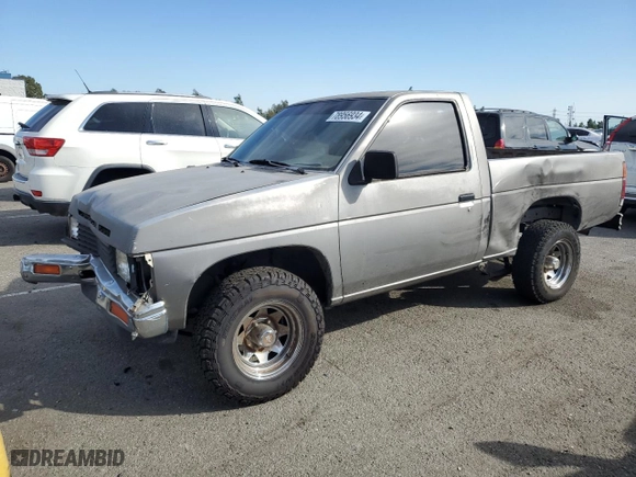 1987 Nissan Regular Bed 2WD E with VIN JN6ND11SXHW014073, listed as a Copart auction lot 78956934 with NaN miles and Salvage Title. Bid and sale history available at carsss.com. Image 1.