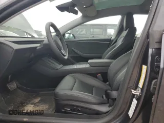 2024 Tesla Model 3 Long Range with VIN 5YJ3E1EB2RF825213, listed as a Copart auction lot 51909875 with 9,717 mi miles and Salvage Title. Bid and sale history available at DreamBid. Image 7.