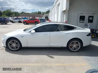 2014 Tesla Model S 60 kWh Battery with VIN 5YJSA1H16EFP51461, listed as a IAAI auction lot 40636898 with 90,762 mi miles. Bid and sale history available at carsss.com. Image 14.