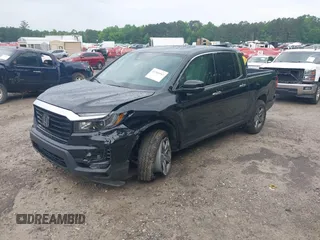 2023 Honda Ridgeline RTL-E with VIN 5FPYK3F77PB052828, listed as a IAAI auction lot 42366947 with 24,658 mi miles and . Bid and sale history available at DreamBid. Image 18.