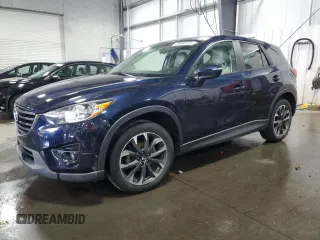 2016 Mazda CX-5 Grand Touring with VIN JM3KE4DY0G0826687, listed as a Copart auction lot 50886975 with 130,493 mi miles and Salvage Title. Bid and sale history available at carsss.com. Image 1.