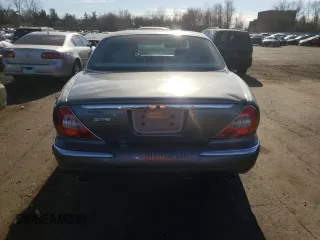 2004 Jaguar XJ with VIN SAJWA71C74SG34056, listed as a Copart auction lot 80083014 with 0 mi miles and Salvage Title. Bid and sale history available at carsss.com. Image 6.