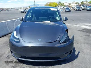 2024 Tesla Model Y Long Range z VIN 7SAYGDEE2RA233855, wystawiony jako IAAI lot #42148956 z przebiegiem 14 385 mil mil oraz . Historia ofert i sprzedaży dostępna na DreamBid. Obrazek 18.