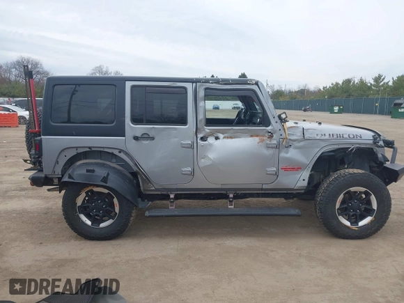 2015 Jeep Wrangler Unlimited Rubicon with VIN 1C4BJWFG1FL546018, listed as a IAAI auction lot 42060045 with 107,249 mi miles and . Bid and sale history available at DreamBid. Image 14.