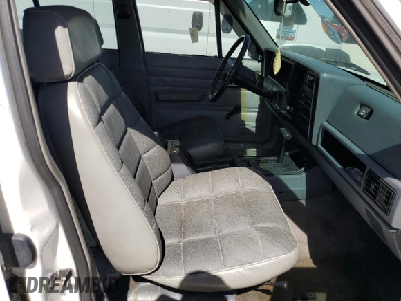 1994 Jeep Cherokee SE with VIN 1J4FT28SXRL151422, listed as a Copart auction lot 77358594 with 74,628 mi miles and Salvage Title. Bid and sale history available at carsss.com. Image 7.
