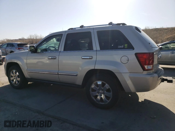 2010 Jeep Grand Cherokee Limited with VIN 1J4RR5GT3AC135686, listed as a Copart auction lot 52961465 with 136,034 mi miles and Salvage title. Bid and sale history available at DreamBid. Image 2.