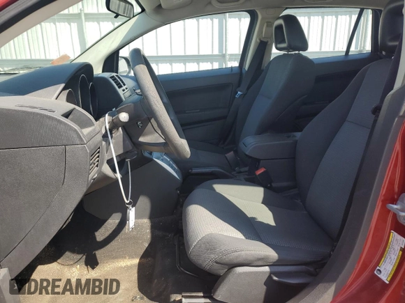 2009 Dodge Caliber SXT with VIN 1B3HB48A29D144304, listed as a Copart auction lot 53119375 with 173,778 mi miles and Salvage Title. Bid and sale history available at DreamBid. Image 7.