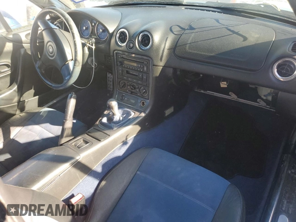 1999 Mazda MX-5 Miata with VIN JM1NB3532X0134801, listed as a Copart auction lot 83838374 with 97,015 mi miles and Salvage title. Bid and sale history available at DreamBid. Image 8.